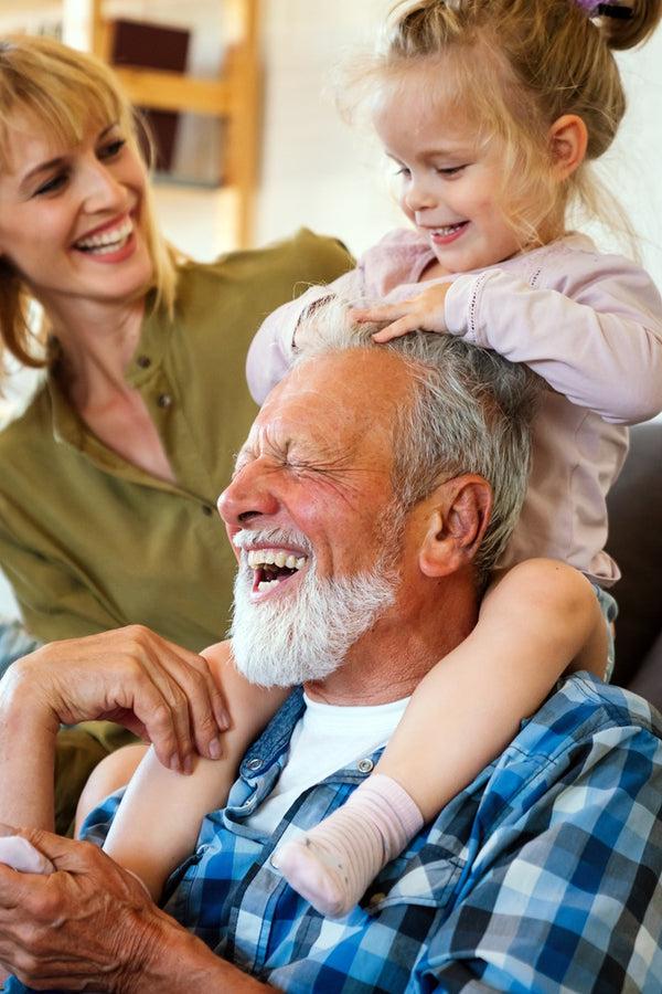 Smiling man with family - Nomo Elderly Fall Detection