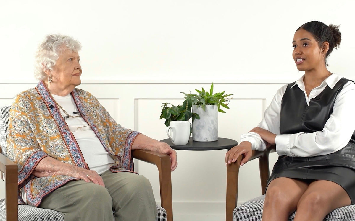 Barbie and Olivia, Nomo Smart Care users, seated across from each other in conversation