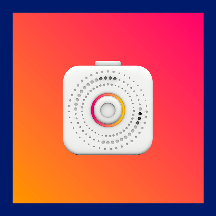 Square image of front facing nomo hub with pink and orange gradient background 